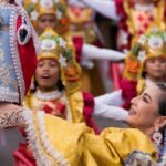 Vibrant Kuraldal Festival with traditional attire and statue of Saint Lucy.