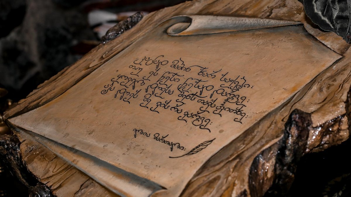 A detailed photo of an ancient scroll with intricate calligraphy, symbolizing history.