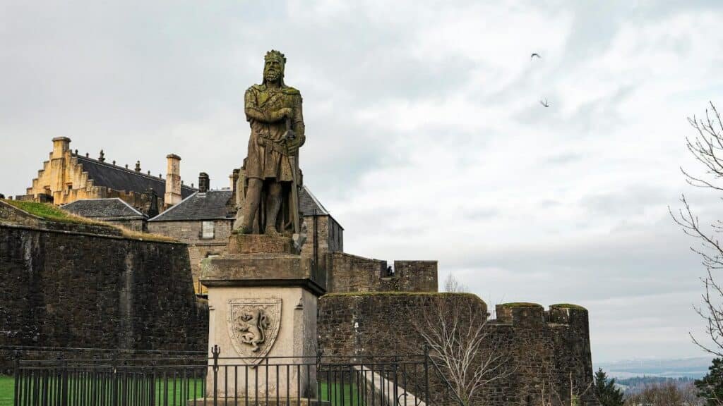Statue of Robert the Bruce at historic Stirling Castle in Scotland, winter scene.