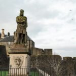 Statue of Robert the Bruce at historic Stirling Castle in Scotland, winter scene.