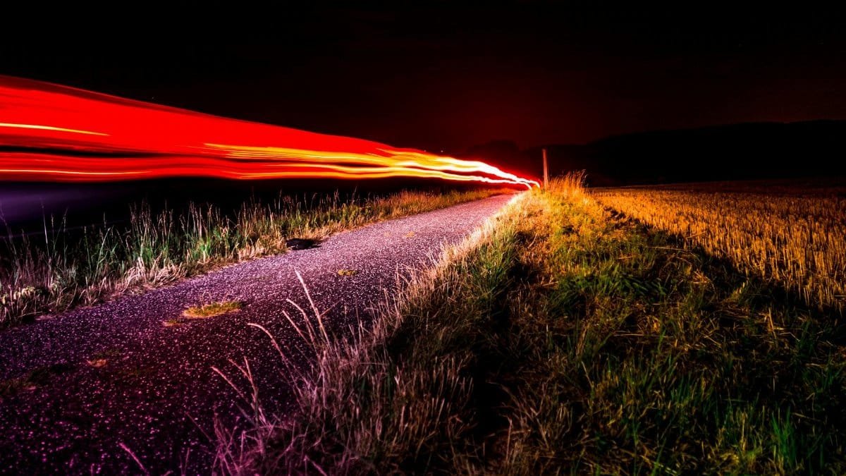Dynamic long exposure of light trails on a night road in Bad Hersfeld, Germany.