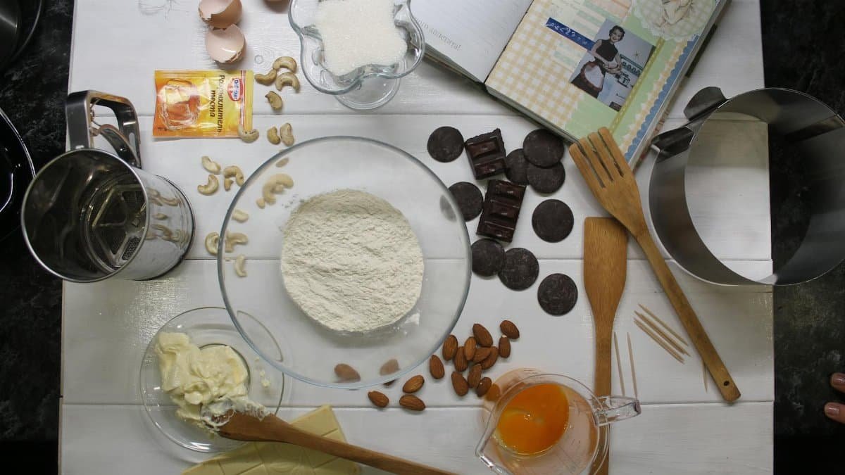 Aerial view of baking ingredients and tools ready for cooking.