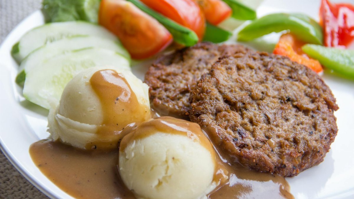 Delicious veggie patties served with mashed potatoes and fresh salad. Perfect for a wholesome meal.