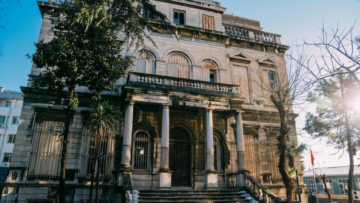 A weathered, historic building facade in Istanbul during a sunny winter day.