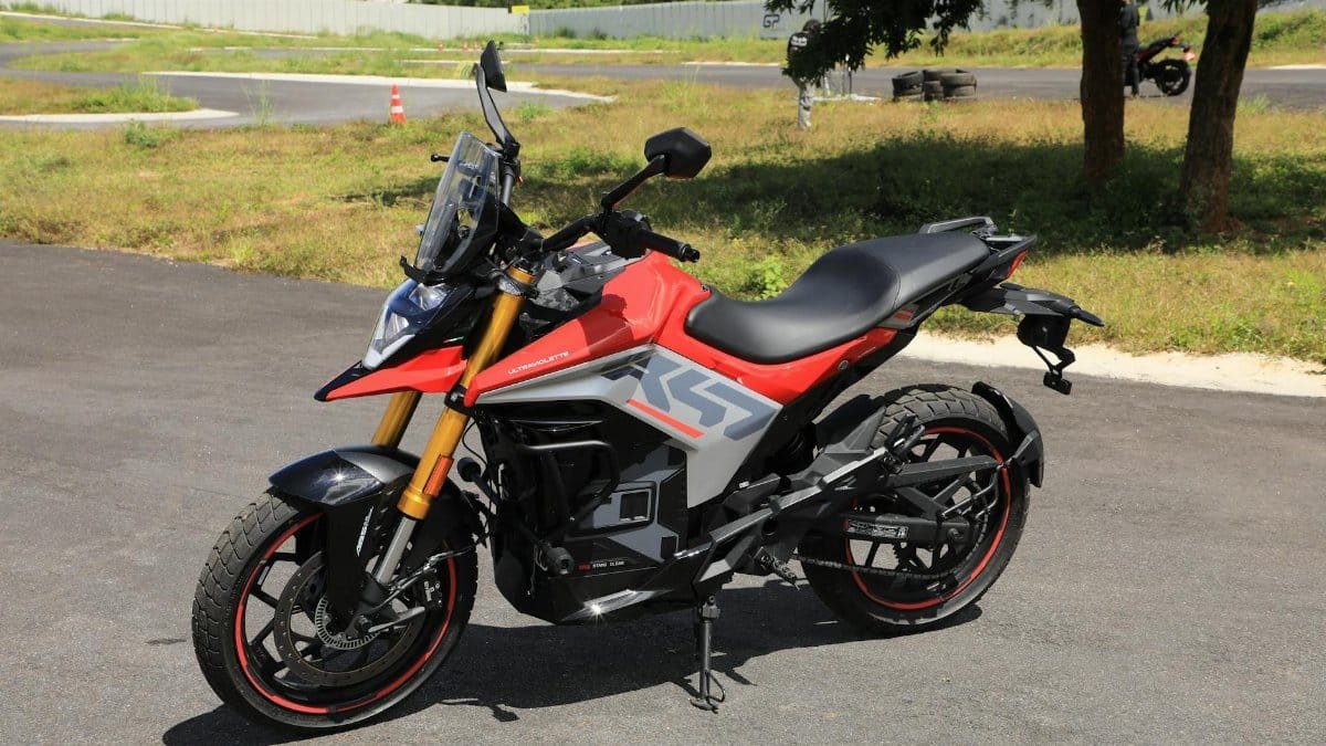 A modern sports bike parked outdoors showcasing sleek design and vibrant colors.