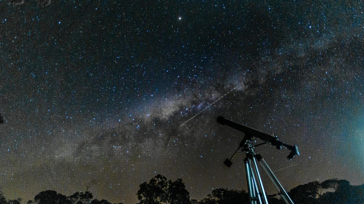 Capture of the starry sky and Milky Way with a telescope under a clear night.