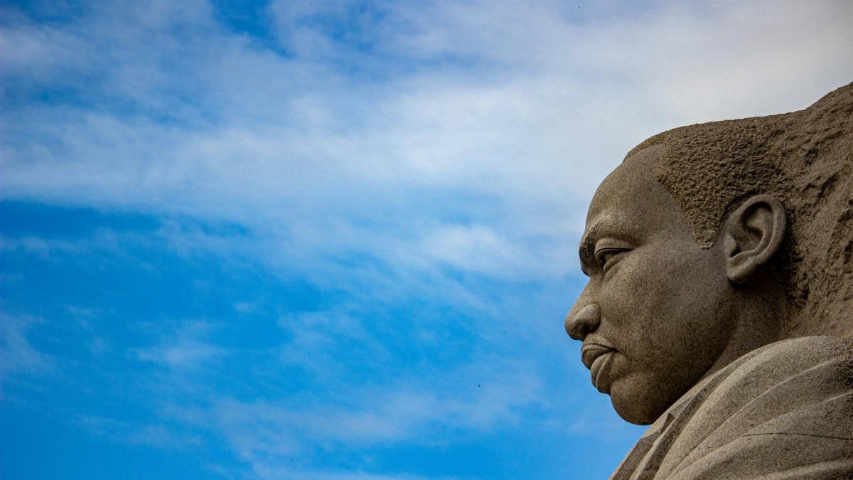 A striking view of the Martin Luther King Jr. Memorial against a blue sky in Washington D.C.