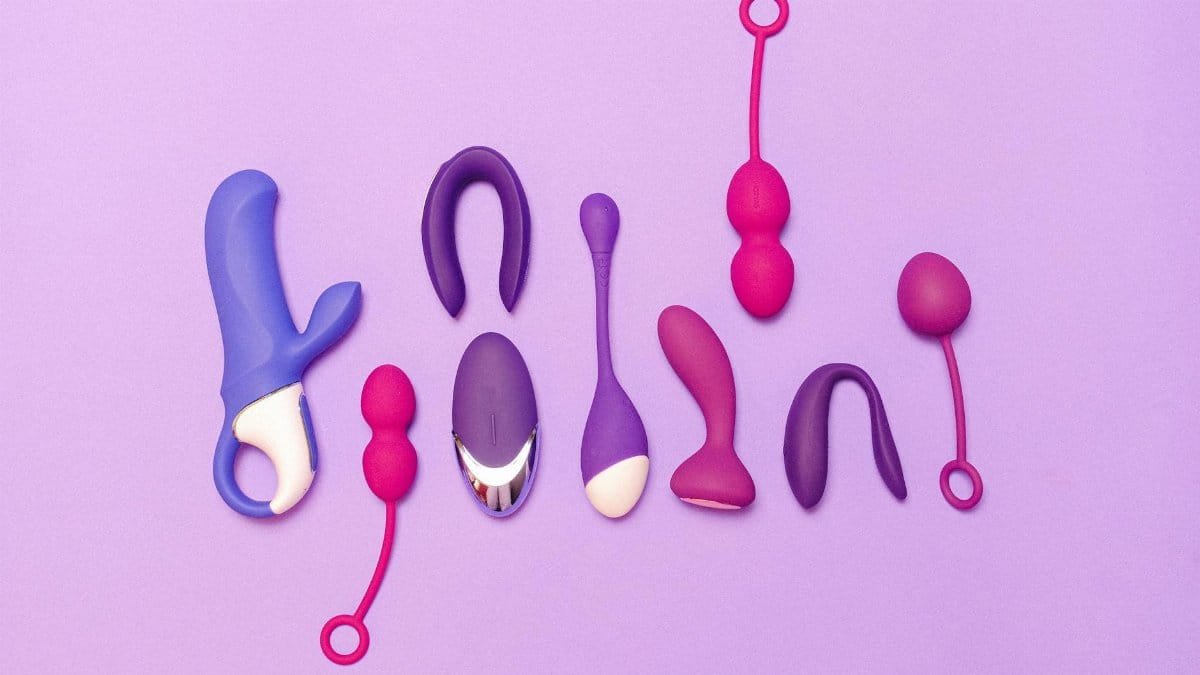 Various silicone sex toys displayed on a purple background for pleasure and education.