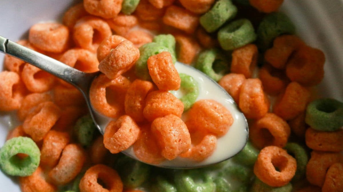 A close-up view of colorful cereal rings in milk, ready for a delicious breakfast.
