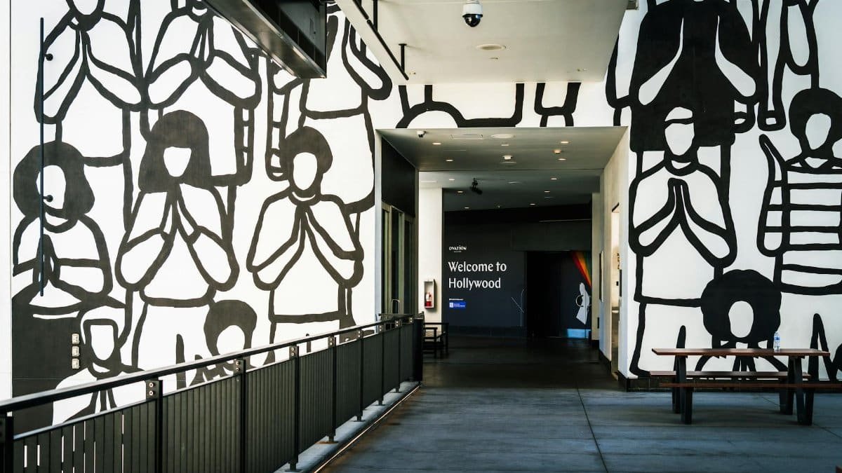 Explore the artistic mural at Ovation Hollywood with a warm welcome sign.