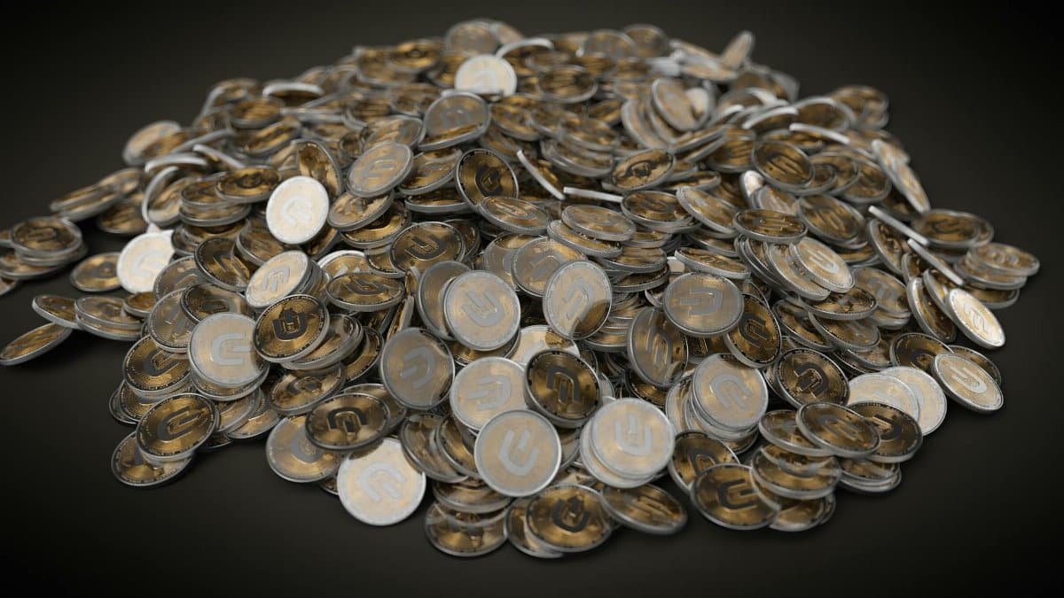 A collection of silver and gold cryptocurrency coins stacked on a dark background, symbolizing digital wealth.