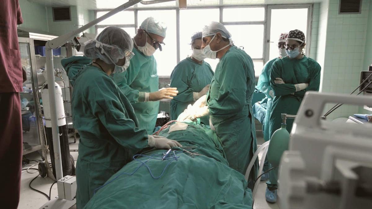 A team of surgeons in an operating room focused on a critical procedure.