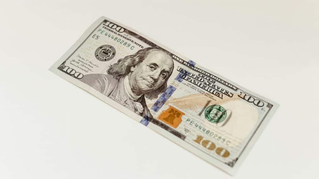 High-quality close-up of a one hundred dollar bill, ideal for finance and business themes.