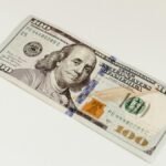 High-quality close-up of a one hundred dollar bill, ideal for finance and business themes.