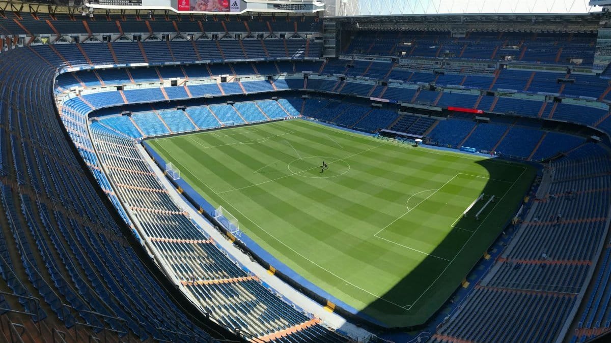 High-angle view of the empty Santiago Bernabeu Stadium on a sunny day in Madrid, Spain.