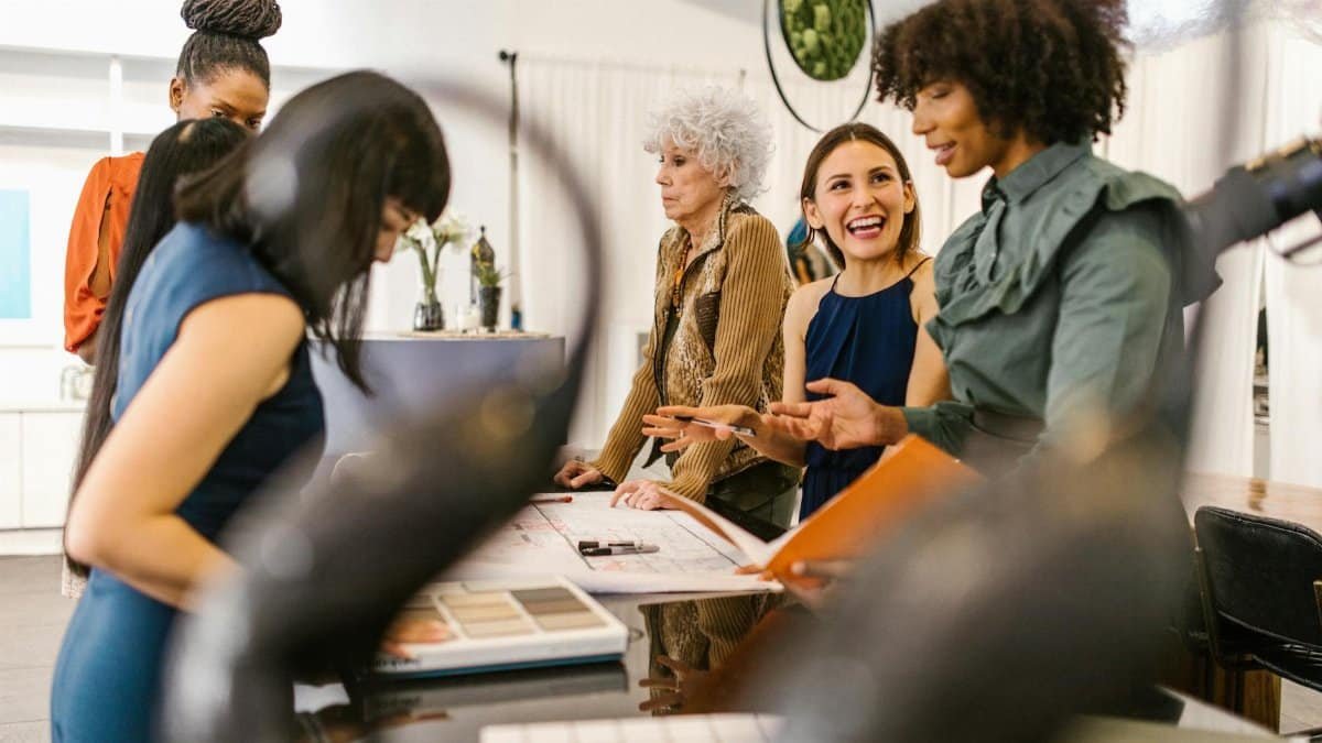 A group of diverse businesswomen having an interactive meeting in a modern office setting.