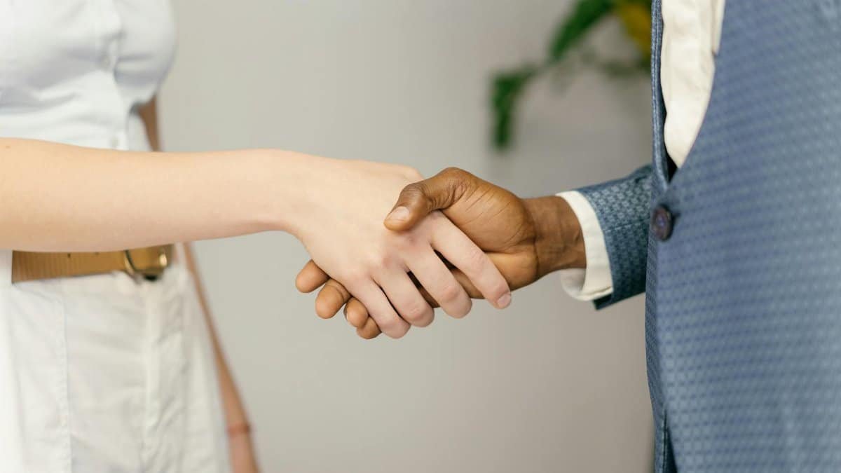 Close-up of a professional handshake symbolizing agreement and partnership in business.