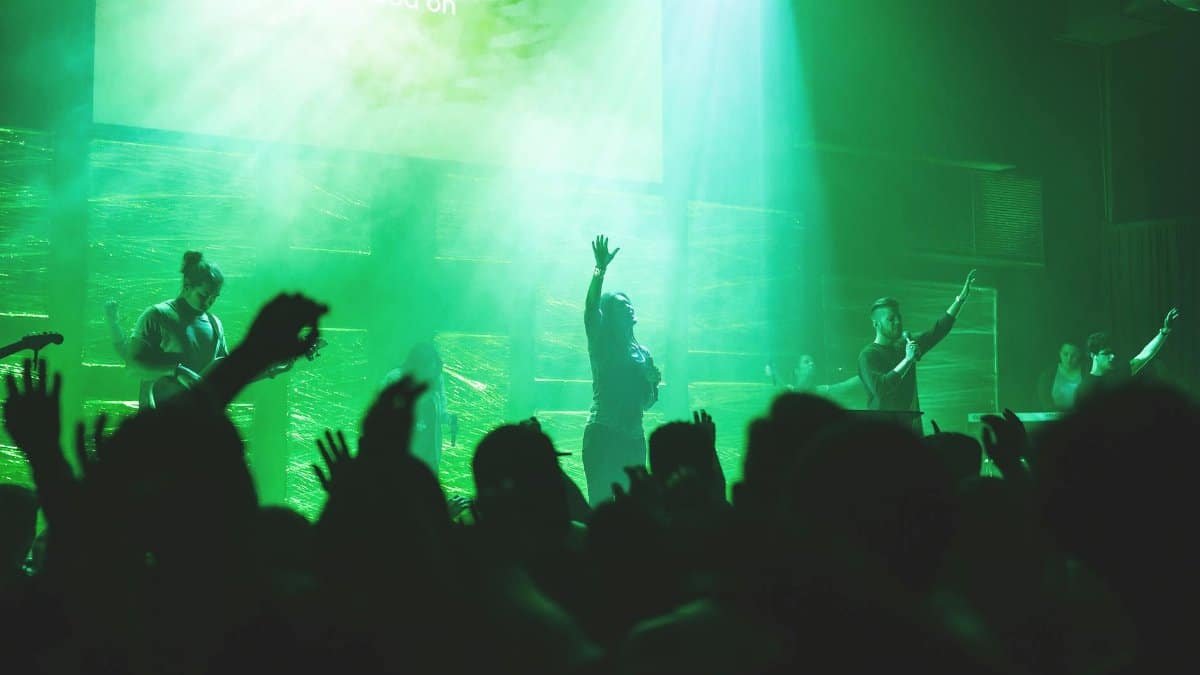 Dynamic church worship concert with a band performing on stage, creating a vibrant atmosphere.