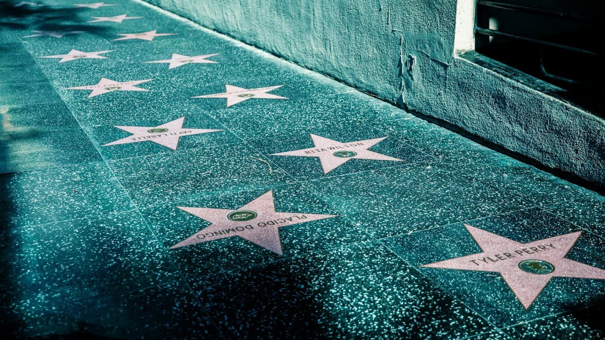 View of Hollywood Walk of Fame with stars on the sidewalk in Los Angeles, California.