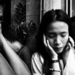 A diverse group of adults covers their ears in distress, illustrating overwhelming sound or noise.