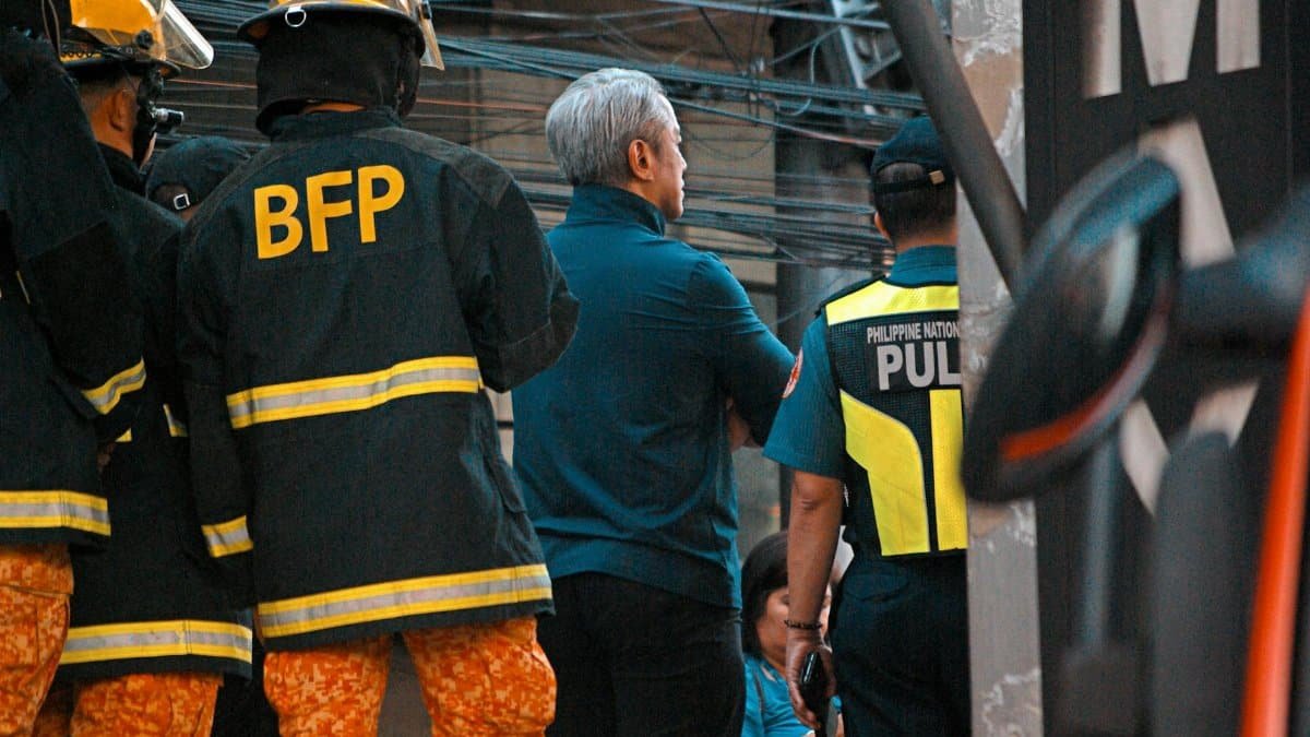 Emergency responders from BFP and police team collaborate at an urban crisis scene.