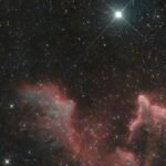 Stunning image of the IC 59 nebula in the constellation Cassiopeia with surrounding stars.