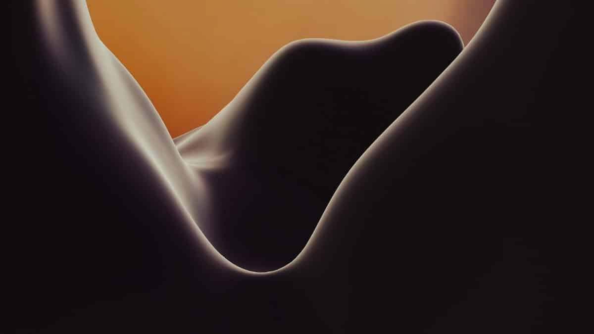 A mesmerizing abstract photograph of smooth curves with warm lighting, perfect for artistic backgrounds.