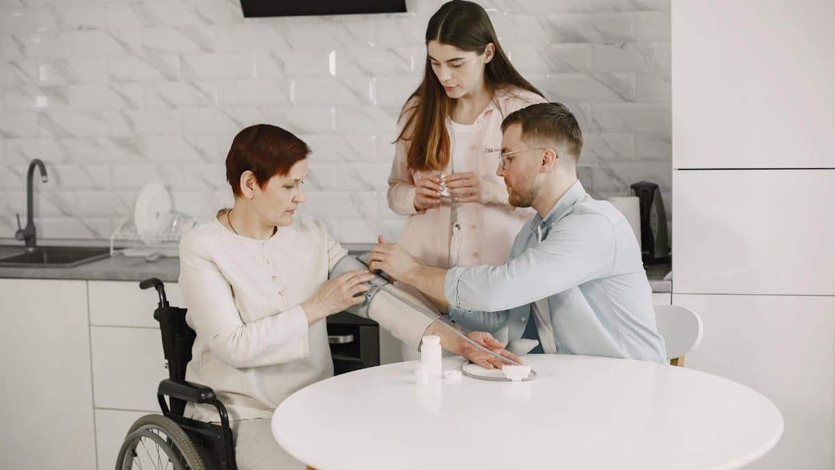 A family monitors blood pressure at home, ensuring health and wellness.