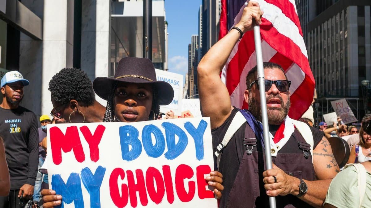 A vibrant group of diverse protesters in New York City advocates for bodily autonomy.