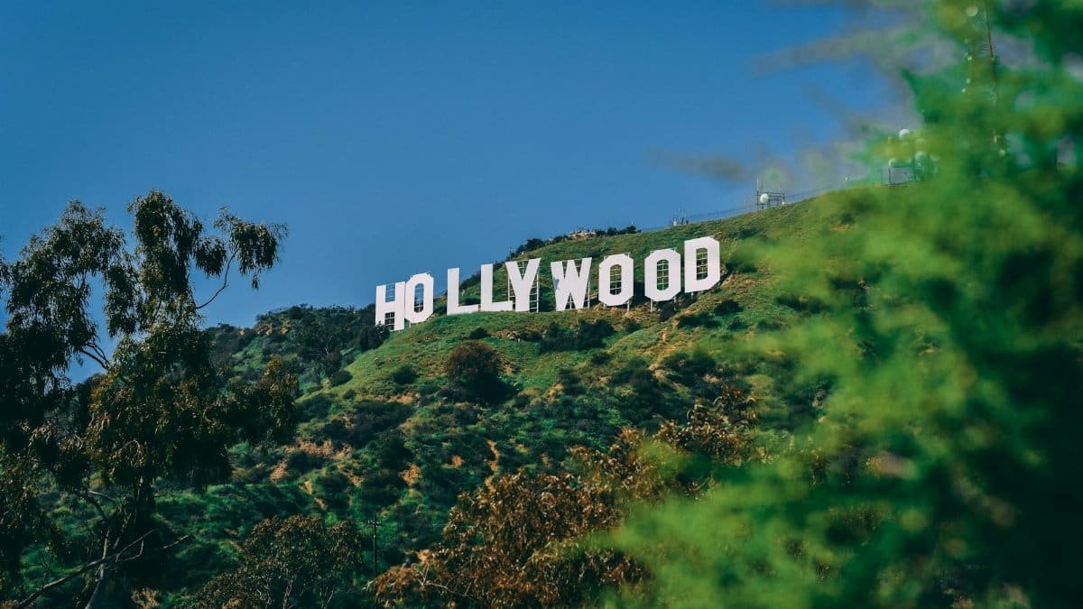 A scenic view of the famous Hollywood sign on a sunny day in Los Angeles.