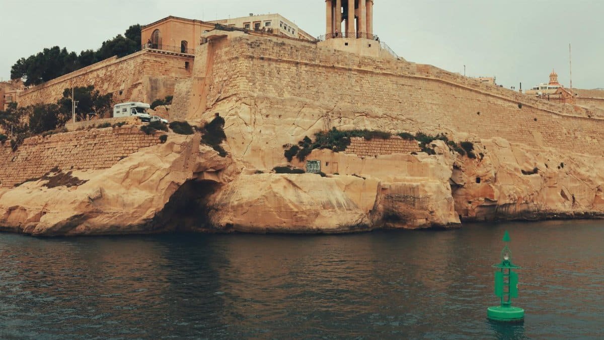 View of Valletta's historic seafront featuring the Siege Bell War Memorial.