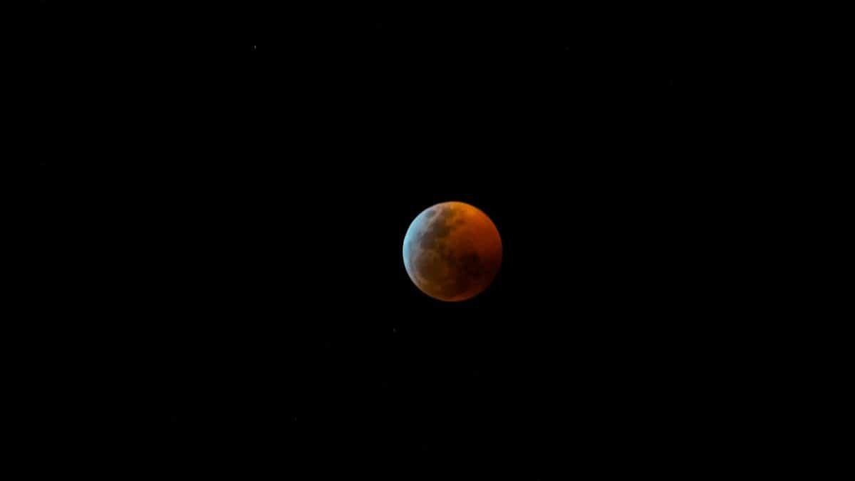 Captivating view of the blood moon during a total lunar eclipse against the night sky.