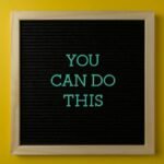 Inspirational message 'You Can Do This' displayed on a blackboard with a bold yellow backdrop.