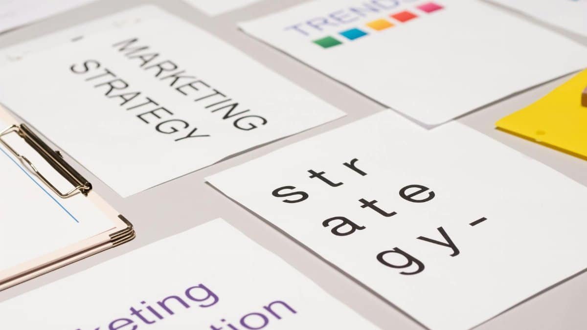 A top view of marketing strategy documents and graphs arranged on a desk, showcasing business planning.