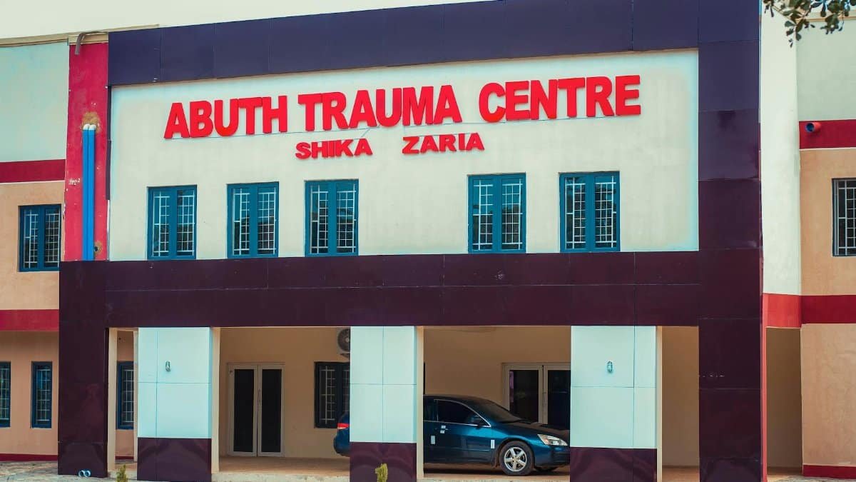 Front view of ABUTH Trauma Centre in Shika, Zaria, Nigeria. Modern medical facility architecture.