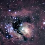 Stunning view of a nebula and star clusters illuminating the night sky.