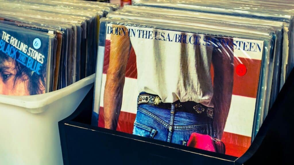 Collection of classic vinyl records including Bruce Springsteen and Rolling Stones.