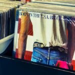Collection of classic vinyl records including Bruce Springsteen and Rolling Stones.