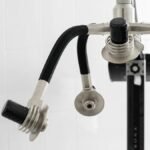 Contemporary laser machine with adjustable heads for weight loss placed in light room on white background in modern clinic with professional equipment