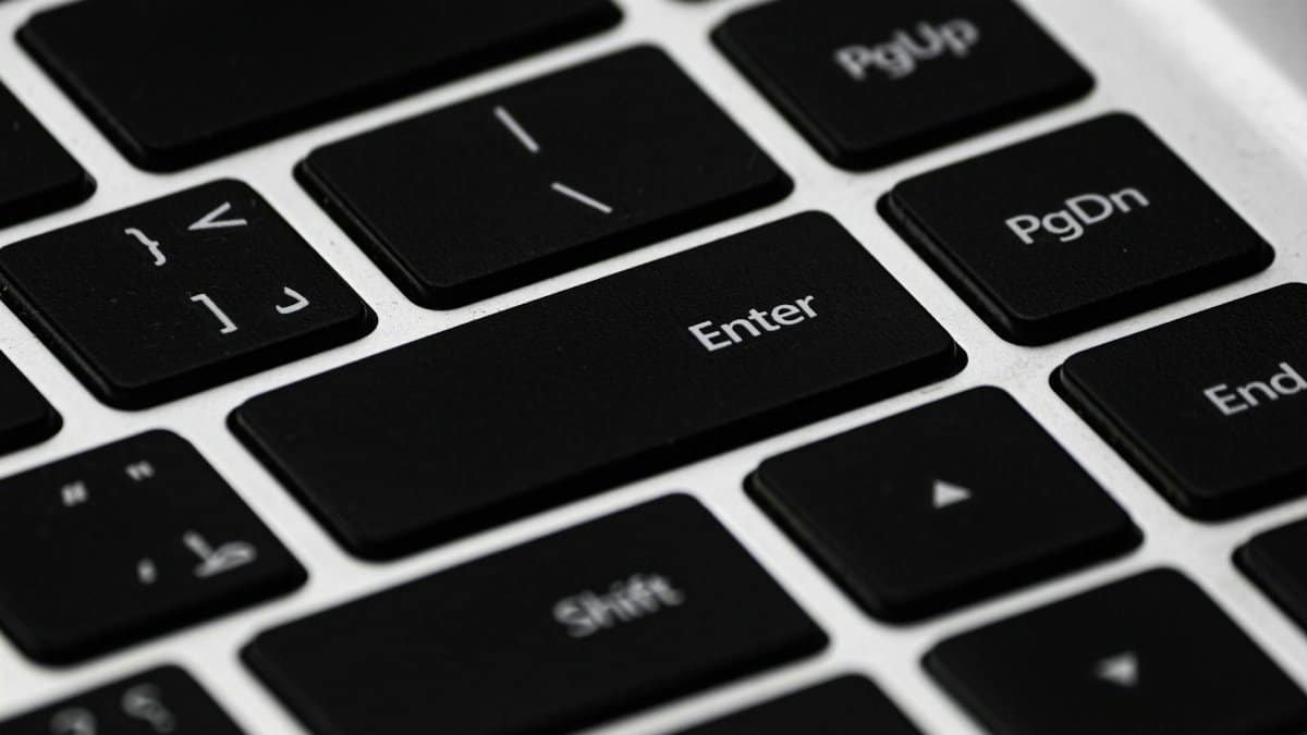 High-resolution close-up of a black laptop keyboard emphasizing details and design.