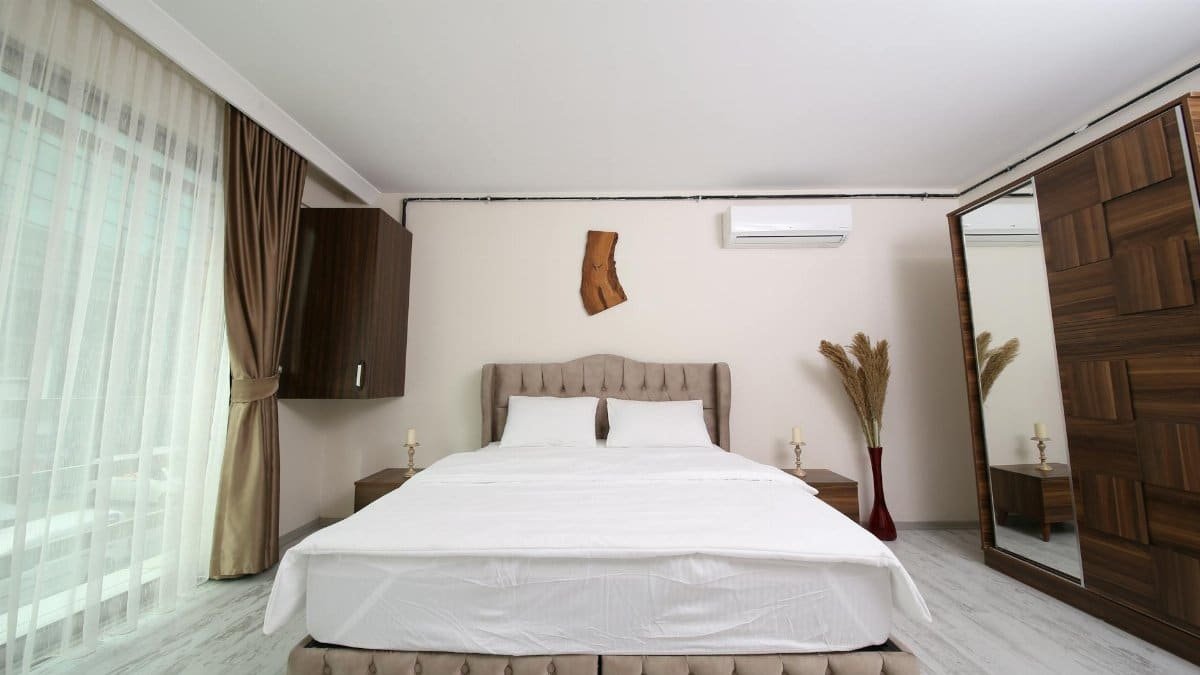 Contemporary bedroom with elegant furniture and decor in an Istanbul hotel room.