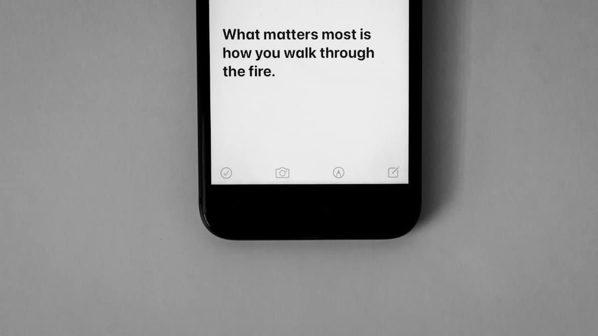 Inspirational quote displayed on a smartphone screen with a monochrome aesthetic.