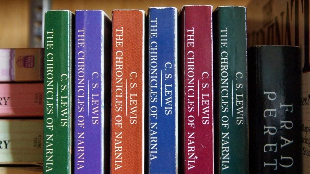 Rows of C.S. Lewis's 'The Chronicles of Narnia' books on a shelf, vibrant and inviting.