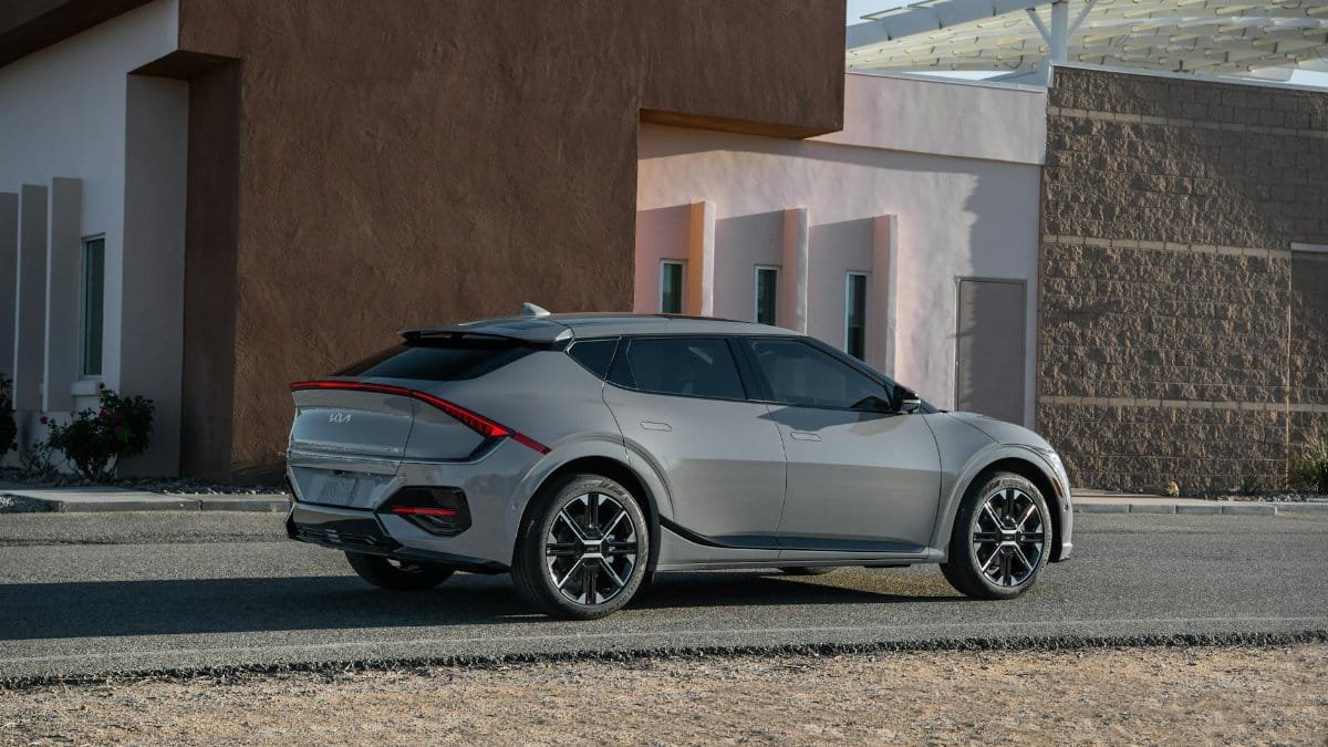 Sleek Kia EV6 GT-Line parked outside a modern building, showcasing futuristic design and innovation.