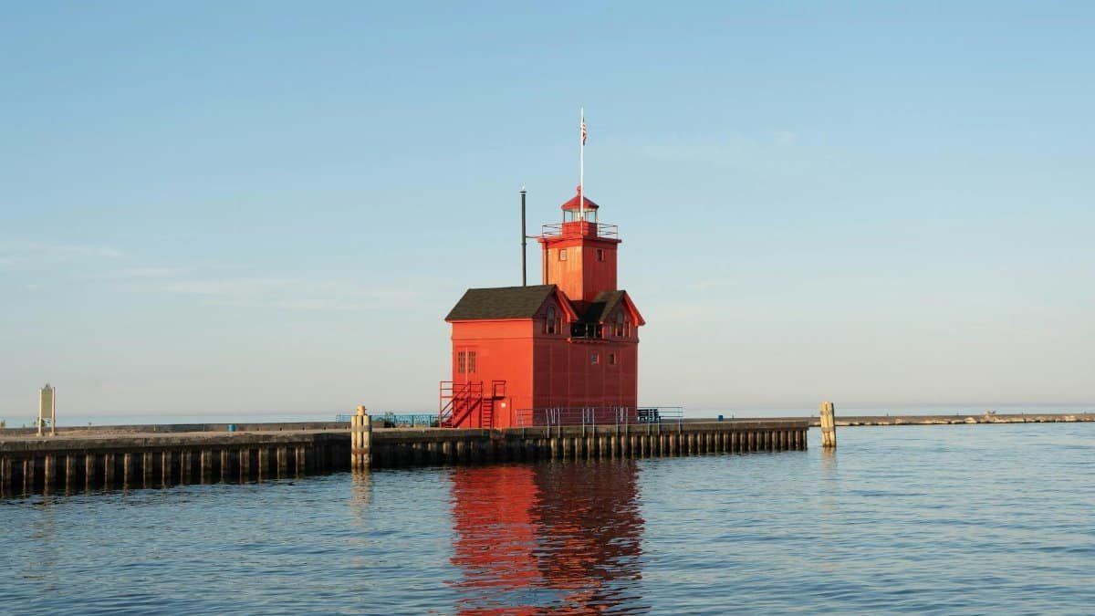 Capture of the vibrant Holland Harbor Lighthouse during a serene summer evening on Lake Michigan.