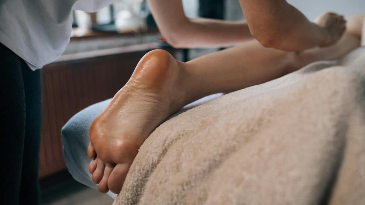 A soothing foot massage in a calming indoor setting, promoting relaxation and self-care.