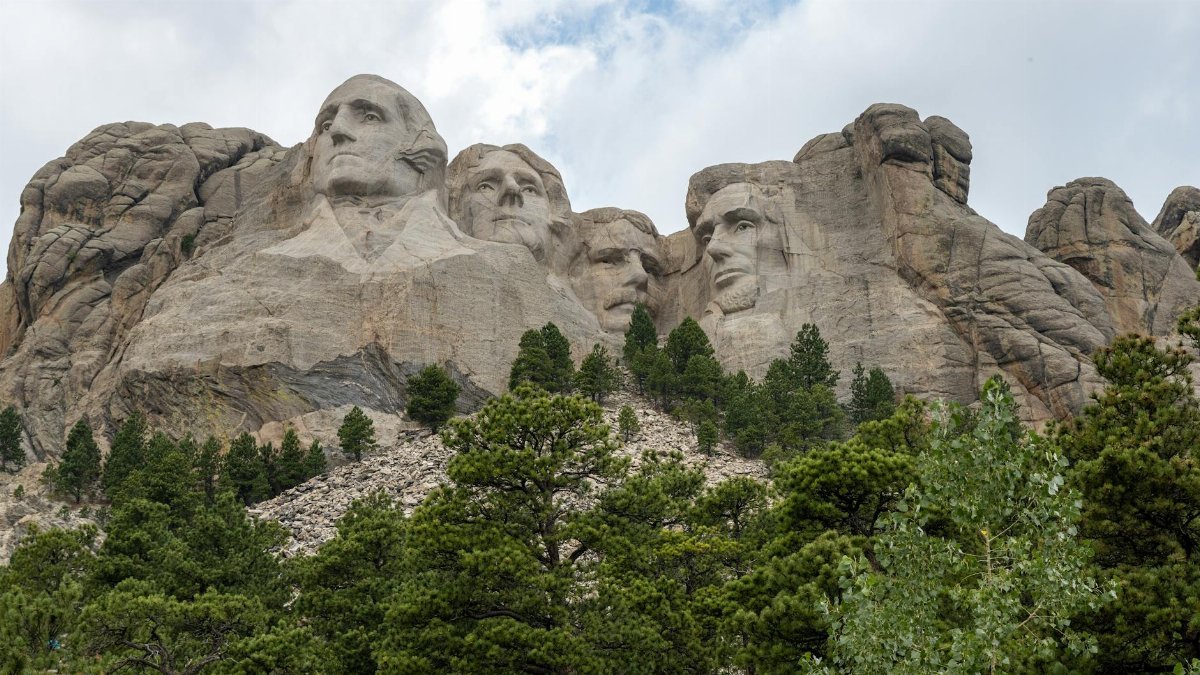 Explore the iconic Mount Rushmore with its monumental sculptures of four American presidents.