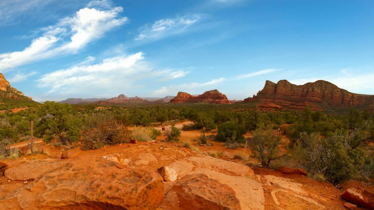 Explore the breathtaking red rock formations of Sedona, Arizona, captured on a clear day.