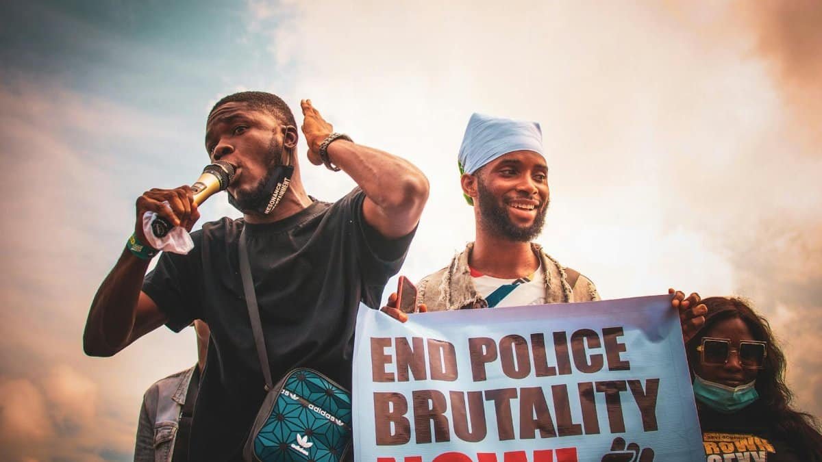 Demonstrators in Nigeria holding placards demanding an end to police brutality.