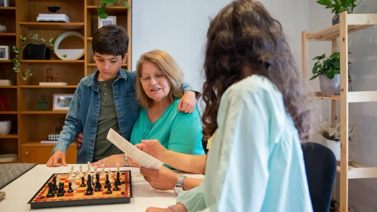 Family bond strengthened through chess at home, featuring multiple generations.